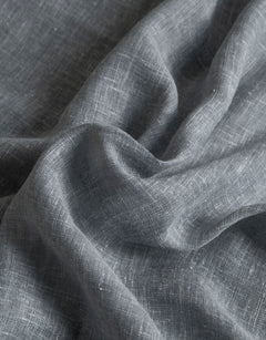 Close-up of blue curtain fabric in a linen blend