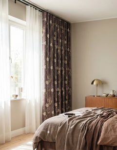 Room-darkening brown curtain with a floral pattern